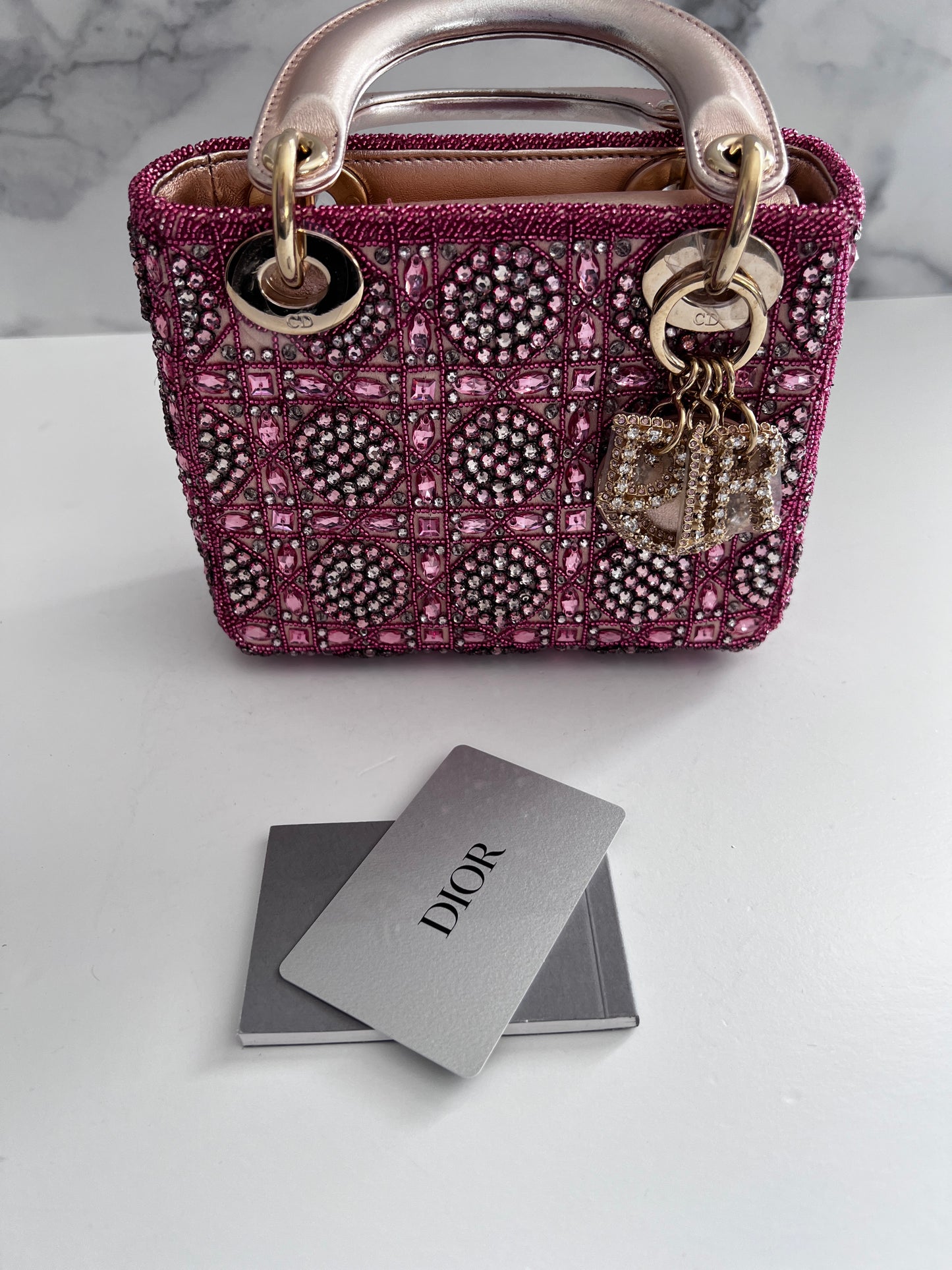 Pre-loved Mini Lady Dior Bag
Metallic Lambskin and Rose des Vents Satin Embroidered with Beads
