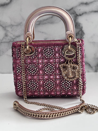 Pre-loved Mini Lady Dior Bag
Metallic Lambskin and Rose des Vents Satin Embroidered with Beads