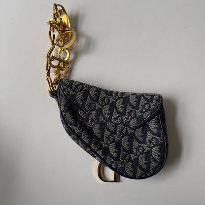 Vintage John Galliano era Dior Diorissimo Mini Saddle Charm Wristlet Bag in Navy Oblique Canvas with Gold-tone hardware.