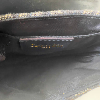 Vintage John Galliano era Dior Diorissimo Mini Saddle Charm Wristlet Bag in Navy Oblique Canvas with Gold-tone hardware.