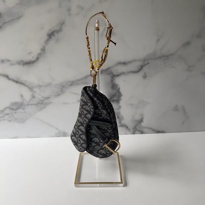 Vintage John Galliano era Dior Diorissimo Mini Saddle Charm Wristlet Bag in Navy Oblique Canvas with Gold-tone hardware.