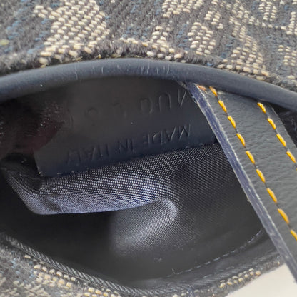 Vintage John Galliano era Dior Diorissimo Mini Saddle Charm Wristlet Bag in Navy Oblique Canvas with Gold-tone hardware.