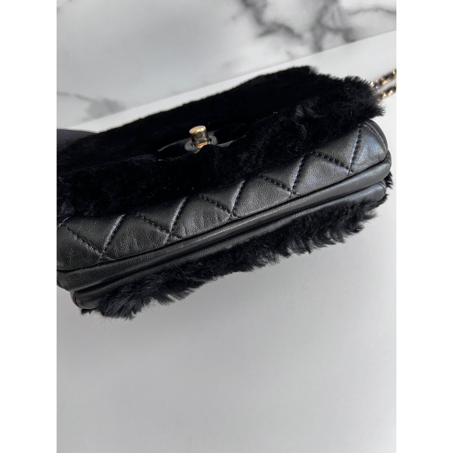 CHANEL black calfskin leather with black shearling flap bag, 2017.