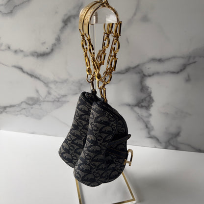 Vintage John Galliano era Dior Diorissimo Mini Saddle Charm Wristlet Bag in Navy Oblique Canvas with Gold-tone hardware.