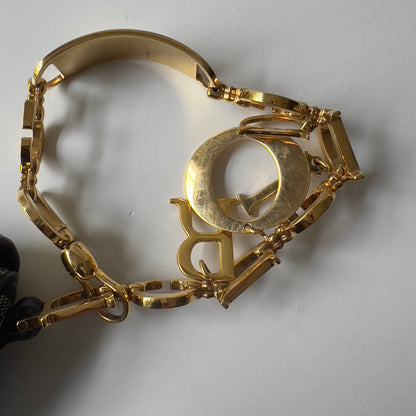 Vintage John Galliano era Dior Diorissimo Mini Saddle Charm Wristlet Bag in Navy Oblique Canvas with Gold-tone hardware.