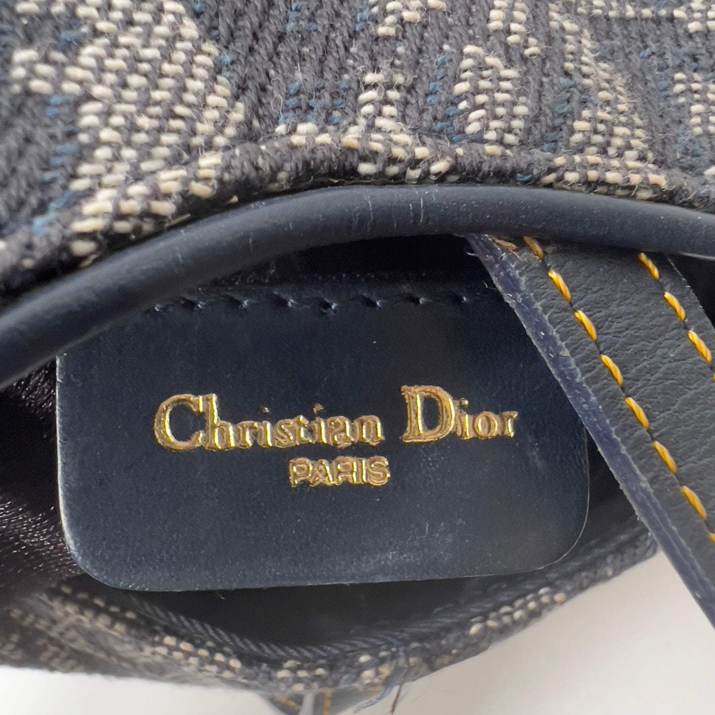 Vintage John Galliano era Dior Diorissimo Mini Saddle Charm Wristlet Bag in Navy Oblique Canvas with Gold-tone hardware.